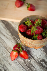 Strawberry In a bowl On a Wooden Background