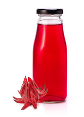 glass jar with red roselle juice