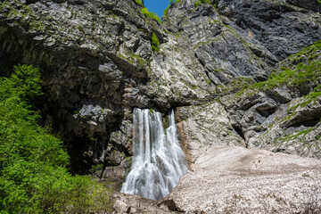Geghsky waterfall in the mountains of the Republic of Abkhazia. Clear sunny day May 14, 2021