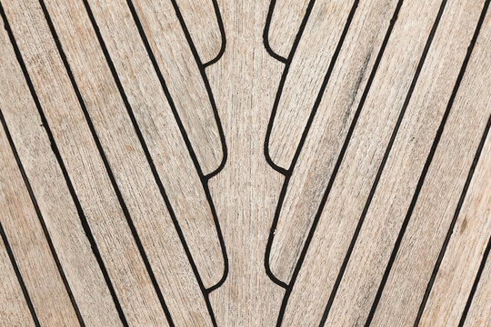 Texture of teak deck on a yacht closeup.