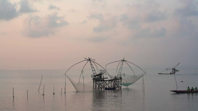 Fisherman's way of life in the morning with catching fish giant yor at Parkpra Phatthalung, Thailand