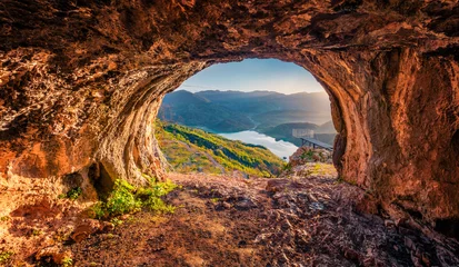 Fotobehang Chocoladebruin Fantastic view from the cave of Bovilla Lake, near Tirana city located. Superb spring landscape. Unbelievable outdor scene of Albania, Europe. Beauty of nature concept background.  © Andrew Mayovskyy