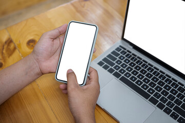 Close up view woman holding mock up mobile phone with empty display.