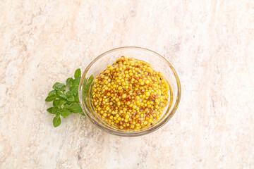 Grain mustard sauce in the bowl