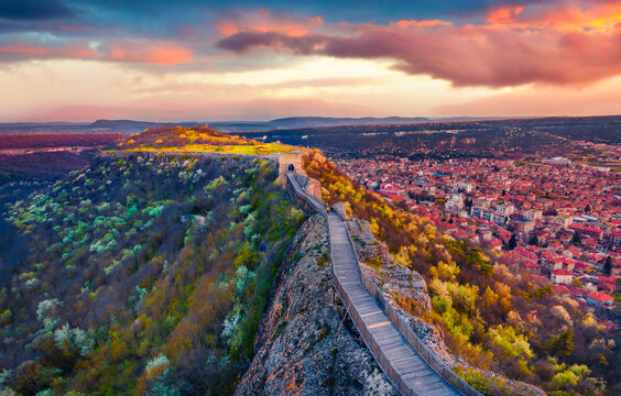 Provadia, Bulgaria - 16.04.2021. Adorable sunset on Ovech Fortress. Colorful spring cityscape of Provadia town, located in a deep karst gorge along the Provadiya River, Bulgaria, Europe.