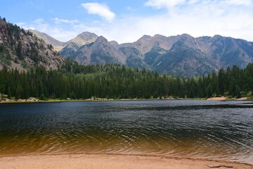 panoramic view of potato lake and the west needle mountains on  a sunny day in summer in the san juan national forest near durango, colorado