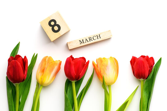 Yellow and red tulips and the inscription on March 8 isolated on white background. Spring and summer backdrop. International Women's Day