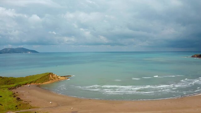 4k drone flight back footage (Ultra High Definition). Sunny morning view from flying drone of Zvernec Beach. Impressive seascape of Adriatic sea. Aerial morning scene of Albania, Europe.