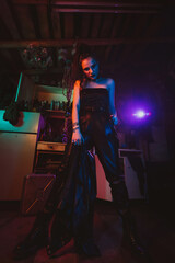 Aggressive cyberpunk girl soldier in the military style. Post-apocalyptic style