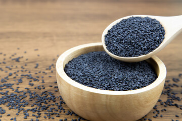 Sesame, Close-up black sesame seeds in a wooden spoon for healthy food and diet concepts.