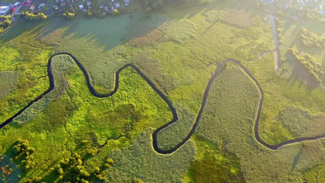 4K aerial - a bird's eye view&nbsp;video (Ultra High Definition). Straight down view of Seret river. Wonderful summer scene of green valley. Beautiful summer scenery.
