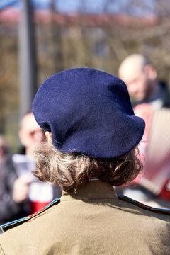 Woman head in blue biret fashion of the last century