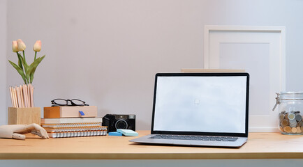 Modern workspace with computer with blank screen and equipment on white table.Blank screen for your information.