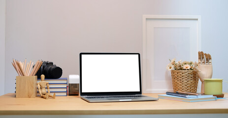 Modern workspace with computer with blank screen and equipment on white table.Blank screen for your information.