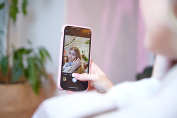 Young beautiful woman with smart phone. Cell phone in the hand of nice girl