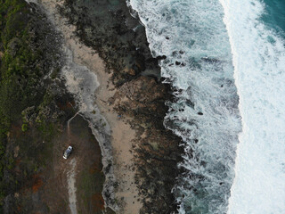 aerial drone view of van life camping by the ocean