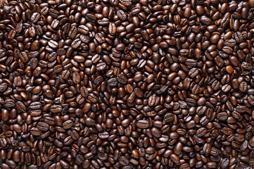 Roasted full coffee beans. Coffee background. Top view, flat lay