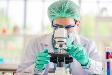 Doctor examines pathogens from blood samples of covid19 patients