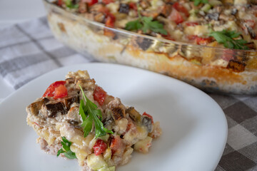 	
diet vegetable casserole with tomatoes, eggplant and pepper, baked over cheese. Vegetarian casserole with zucchini, mushrooms and cherry tomatoes