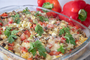 	
diet vegetable casserole with tomatoes, eggplant and pepper, baked over cheese. Vegetarian casserole with zucchini, mushrooms and cherry tomatoes