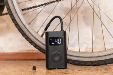 Portable automatic electric smart inflator, air pump for bicycle, car, motorbike, ball and so on © Bohdan