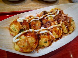 Takoyaki, or Octopus Balls, are one of Japan's best-known street food originated in Osaka. 