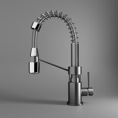 Chrome plated kitchen faucet close up on gray background