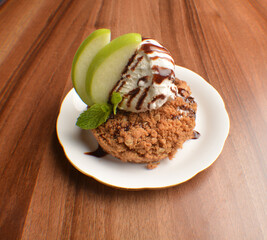 homemade baked apple crumble pie with vanilla ice cream and sliced of green apple fruit on wood table dessert halal menu