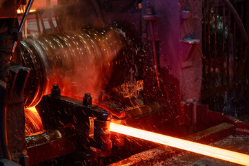 The rolling mill in operation. Manufacturing of hot rolled steel - obrazy, fototapety, plakaty