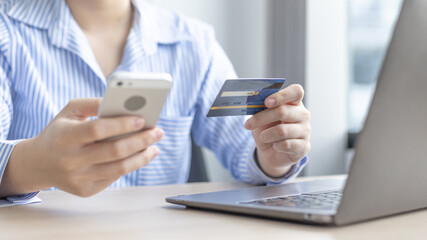 Women use smart phone to register online purchases using credit card payments, Technology for the use of smartphones for business or online financial transactions, Shopping online and banking online.