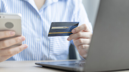 Women use smart phone to register online purchases using credit card payments, Technology for the use of smartphones for business or online financial transactions, Shopping online and banking online.