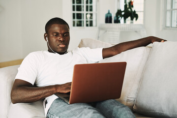 man african appearance at home in front of laptop communication technology