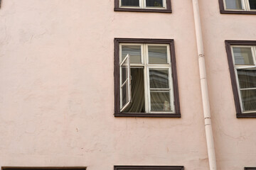 Fototapeta na wymiar Open window on the wall of the house.