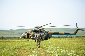 Military helicopter with soldiers. Armed conflict between Israel and Palestine, military action. A...