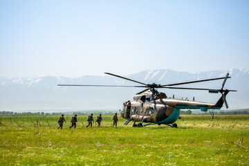 Military helicopter with soldiers. Armed conflict between Israel and Palestine, military action. A...