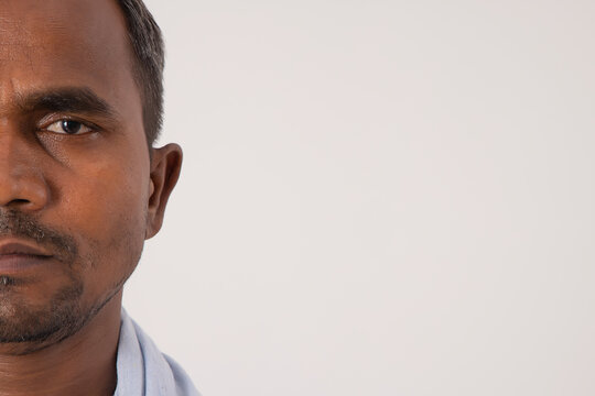 CLOSE SHOT OF A COMMON MAN LOOKING AT CAMERA