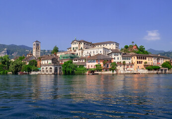 Fototapeta na wymiar San Giulio island in the middle of the Orta lake, famous for the ancient monastery place of peace and meditation.Piedmont, italian lakes, Italy.