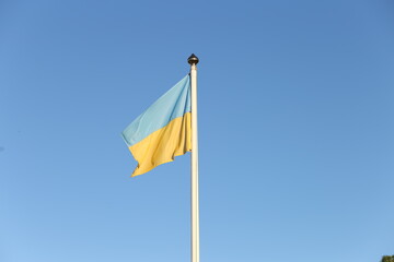 Flag of Ukraine against sky