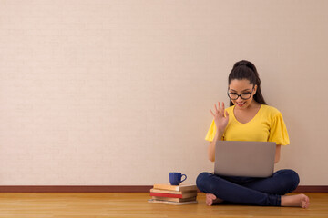 A young woman working on laptop.