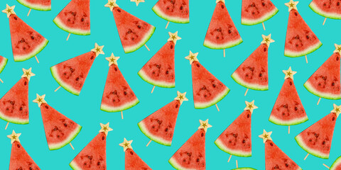 Watermelon lollypop on blue background. Watermelon slices on a stick with a star from an apple top view. Fruit pattern. Banner. Christmas tree made of food. Summer Christmas