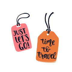 Obraz na płótnie Canvas Two luggage tags with travel inspiration quotes.