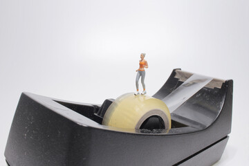 a mini running figure on Tape holder