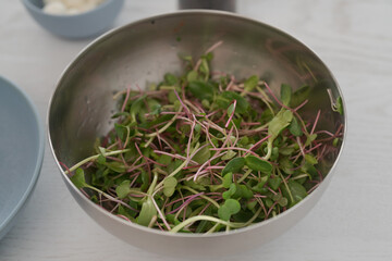 Microgreens in steel bowl ready to make salad