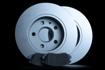 Accessories for cars. New metal car part. Auto motor mechanic spare or automotive piece isolated on black background. Automobile engine service with space for text.