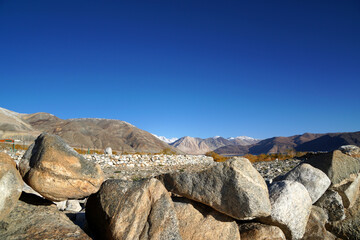 Landscape  Nature Scene of Pangong tso or Pangong Lake with  snow mountain background is best famous destination at Leh Ladakh ,Jammu and Kashmir , India                              