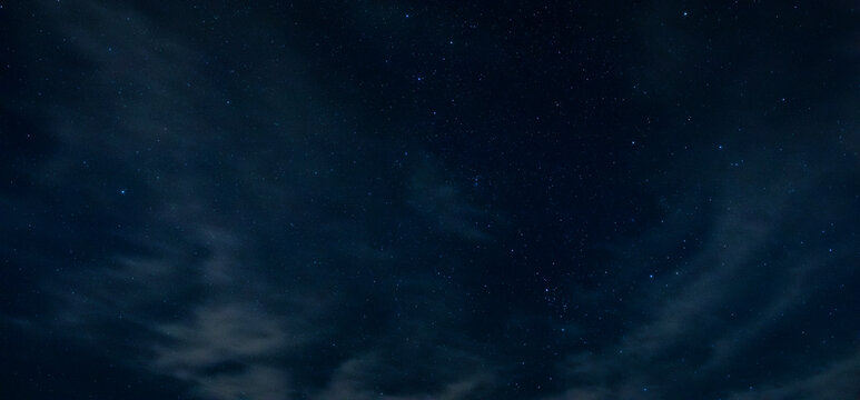 Lake Tillery night sky filled with stars and a few thin clouds floating by