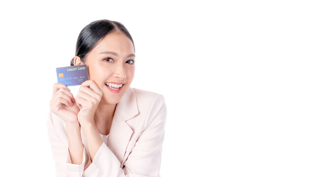 Business Asian woman showing credit card for payment shopping online , paying by credit card online shopping  e-commerce telemarketing concept