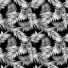 Tropical palm leaves. Seamless modern pattern with exotic plants for textiles, fashionable fabrics, bed linen, decorative pillows, photo wallpaper, interior design. White and black. 