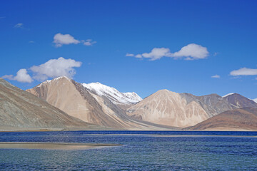 Landscape Nature Scene of Pangong tso or Pangong blue Lake with Himalaya Snow mountain background at Leh Ladakh ,Jammu and Kashmir , India  - unseen travel vacation park and outdoor