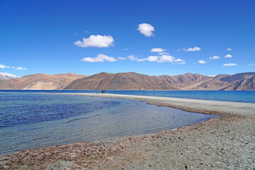 Landscape Nature Scene of Pangong tso or Pangong blue Lake with Himalaya Snow mountain background at Leh Ladakh ,Jammu and Kashmir , India  - unseen travel vacation park and outdoor